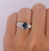 14K White Gold 1.56 Carat Oval Blue Sapphire and Invisible Cluster Diamond Ring