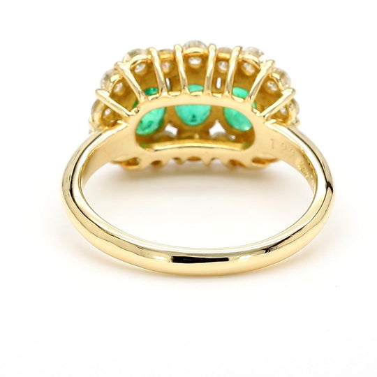 1.22 Carat Emerald & Diamond 18K Gold Halo Three Stone Band Ring