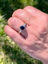 1.48 Carat Oval Cut Blue Sapphire With Princess Cut Diamond Ring in 18k Gold