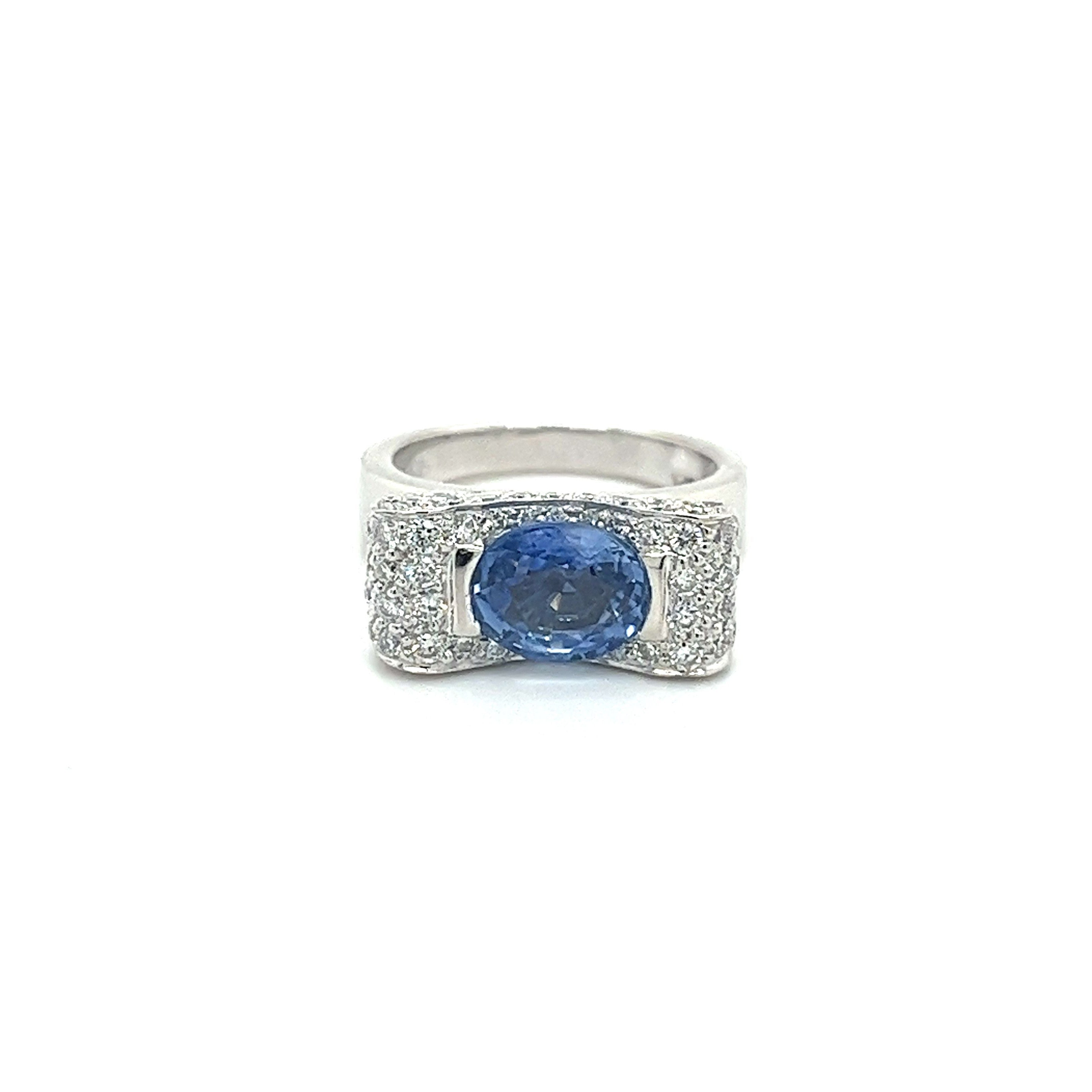 2.20 Carat Oval Cut Tanzanite Half Bezel Bow Style Ring in 18K White Gold