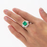 4.42 Carat TW Colombian Emerald with Round & Emerald Cut Diamond Halo Ring