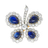 Antique GIA Certified 6 Carat Cabochon-Cut Sapphire and Diamond Floral Brooch