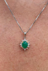 Cabochon Cut Emerald and Diamond pendant in 18k white gold floral/star design