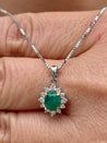 Cabochon Cut Emerald and Diamond pendant in 18k white gold floral/star design