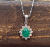 Cabochon Cut Emerald and Diamond pendant in 18k white gold floral/star design