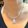 EGL Certified 5.02 Carat Pear Diamond Pendant and Diamond Halo & Sapphire Detail