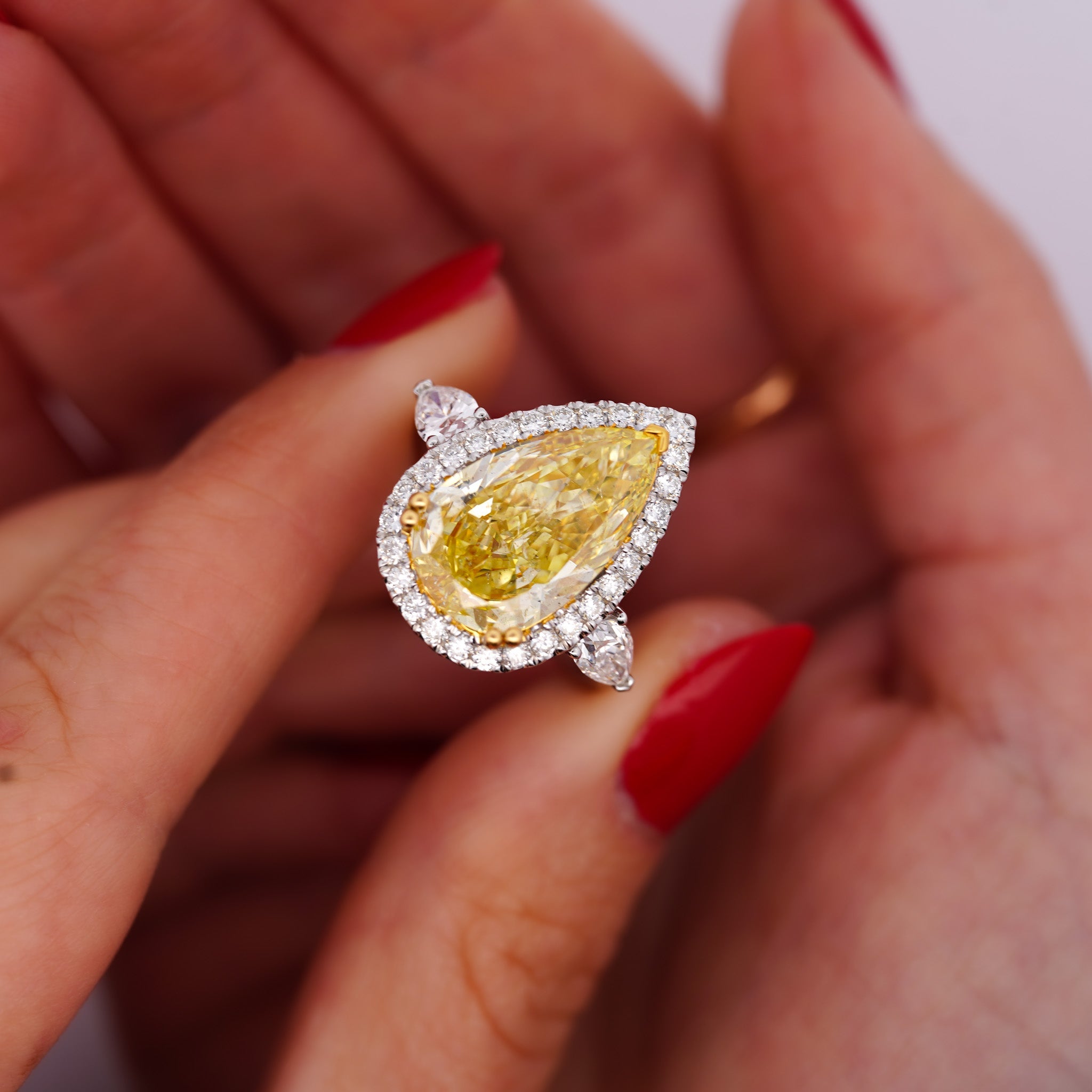 GIA Certified 6.06 Carat Fancy Intense Yellow Pear Cut Diamond 18K Ring