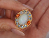 GIA Certified 8 Carat White Opal With Orange Garnet & Aquamarine Halo Ring