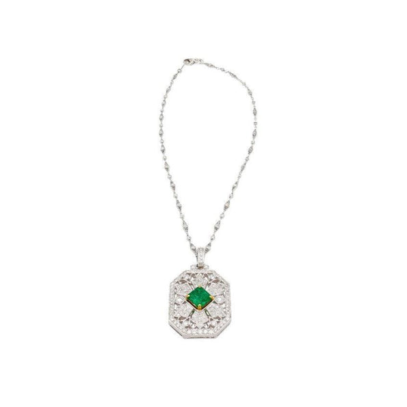 Vintage Carved Platinum 3.16 Carat Vivid Green Minor Oil Emerald Pendant with 4 CTTW in Diamonds
